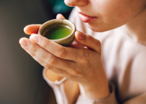 Woman enjoying a warm cup of tea as part of her Mother's Day Gift Sets